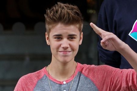 Justin Bieber greets his fans outside the Langham Hotel - London