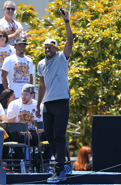 Jun 19, 2015; Oakland, CA, USA; Golden State Warriors guard Andre Iguodala (9) waves to fans during the Golden State Warriors 2015 championship celebration at the Henry J. Kaiser Convention Center. Mandatory Credit: Kelley L Cox-USA TODAY Sports