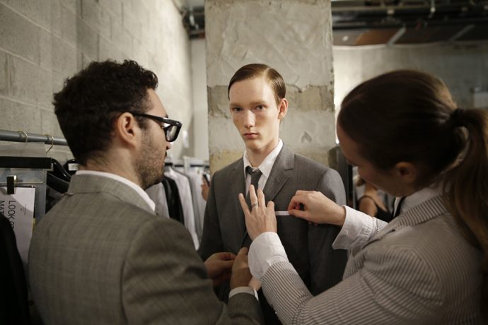 Matthew Pitt of Ontario, Canada, gets ready backstage before a presentation by Thom Browne during Men's Fashion Week in New York, Tuesday, July 14, 2015. (AP Photo/Seth Wenig)