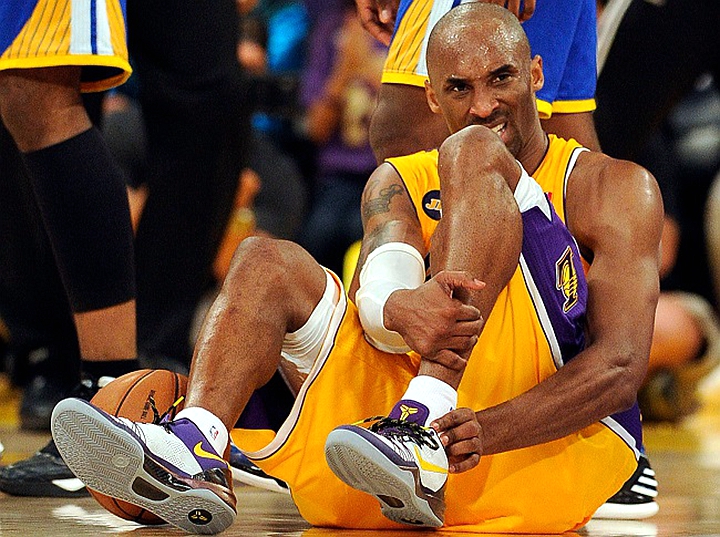 The Lakers' Kobe Bryant #24 sits on the court after hurting his ankle during their game against the Warriors at the Staples Center in Los Angeles Friday, April 12, 2013. The Lakers beat the Warriors 118-116. (Hans Gutknecht/Staff Photographer)