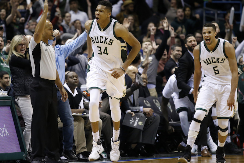 Milwaukee Bucks' Giannis Antetokounmpo reacts after making a three-point basket during overtime of an NBA basketball game against the Atlanta Hawks Friday, Jan. 15, 2016, in Milwaukee. The Bucks won 108-101. (AP Photo/Morry Gash)